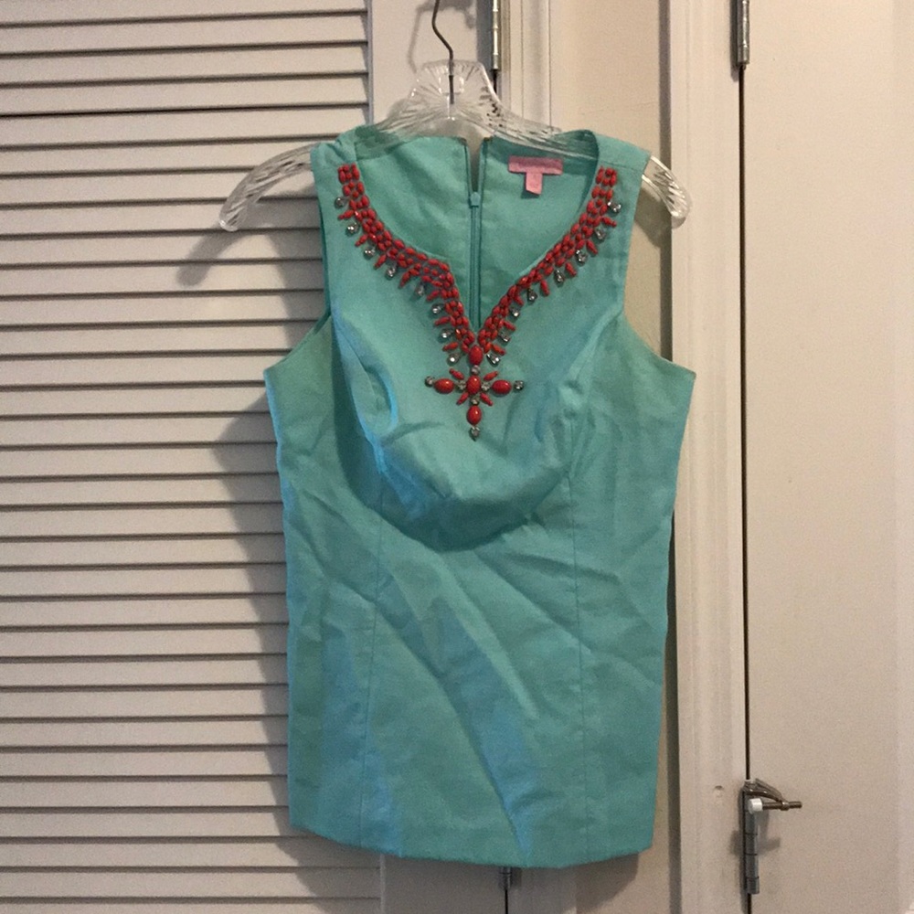 Light blue/teal with pink jewel accented top
